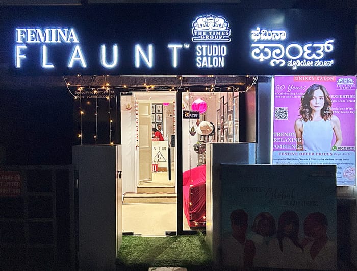 Femina Flaunt Studio Salon storefront at night